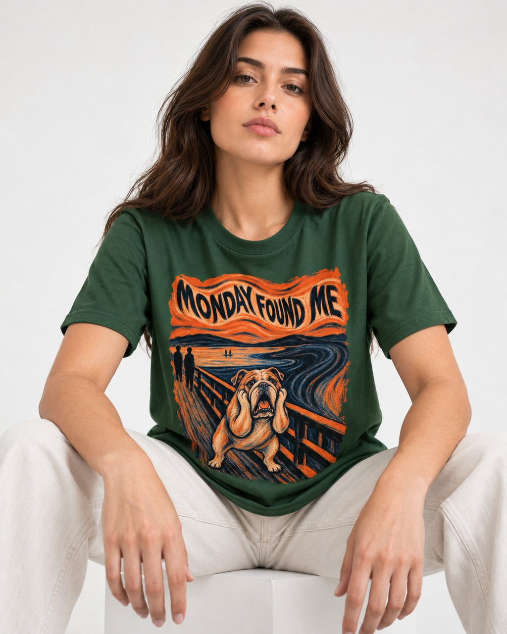 English Bulldog Monday Found Me Scream Graphic T-Shirt in Forest Green, worn by a seated model