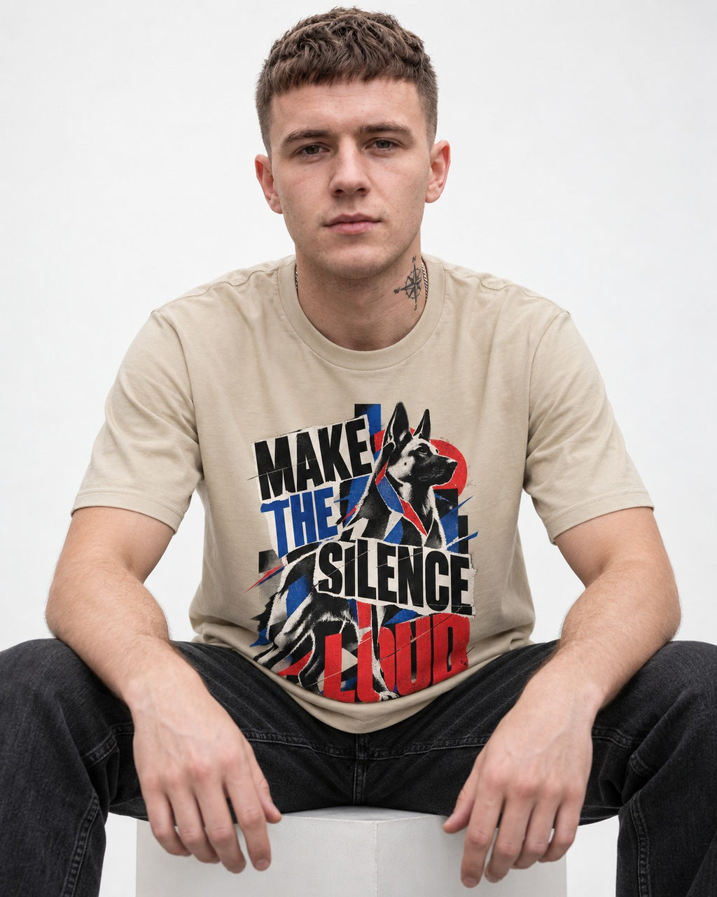 German Shepherd Dog Make the Silence Loud T-Shirt in Sand, worn by a seated model