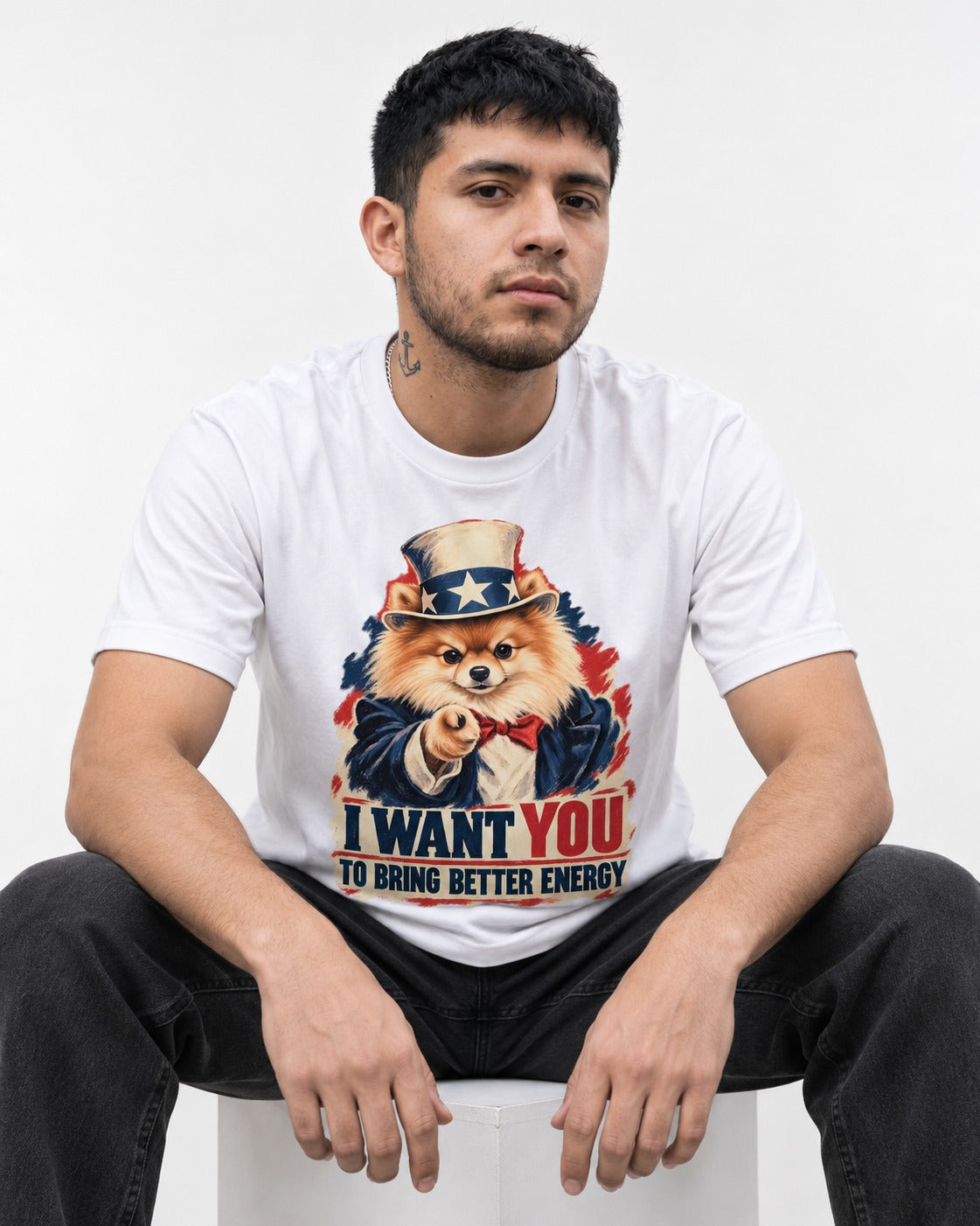 Pomeranian I Want You to Bring Better Energy Uncle Sam Graphic T-Shirt in White, worn by a seated model