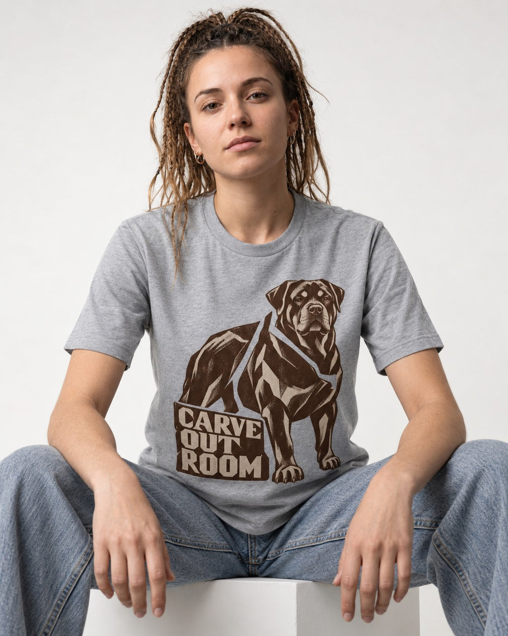 Carve Out Room for Rottweiler T-Shirt in Sport Grey, worn by a seated model