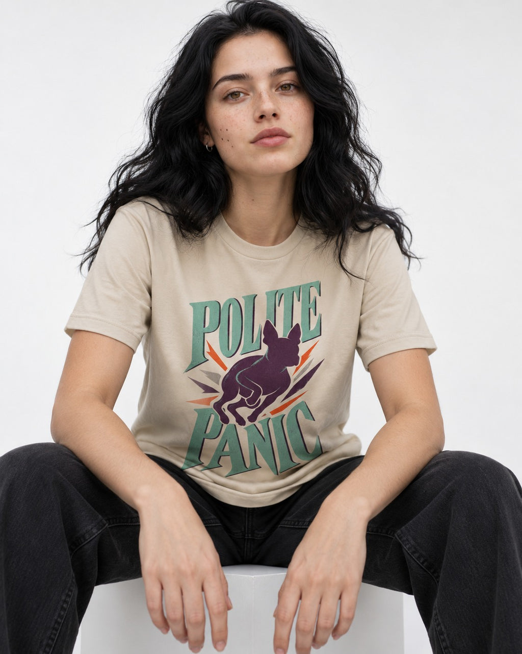 Polite Panic Boston Terrier T-Shirt in Sand, worn by a seated model