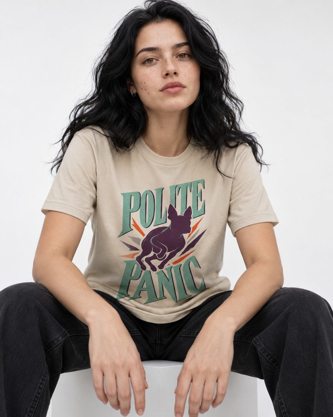 Polite Panic Boston Terrier T-Shirt in Sand, worn by a seated model