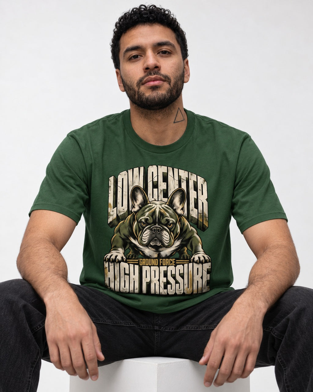 Frenchie Low Center High Pressure Graphic T-Shirt in Forest Green, worn by a seated model