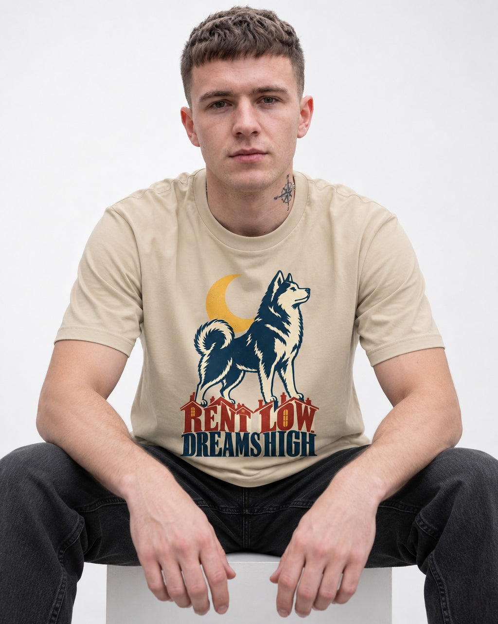 Husky Dreams High T-Shirt in Sand, worn by a seated model