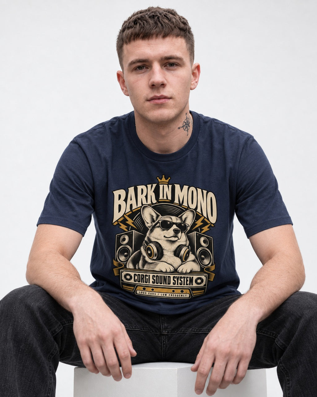 Corgi Bark in Mono Sound System T-Shirt in Navy, worn by a seated model
