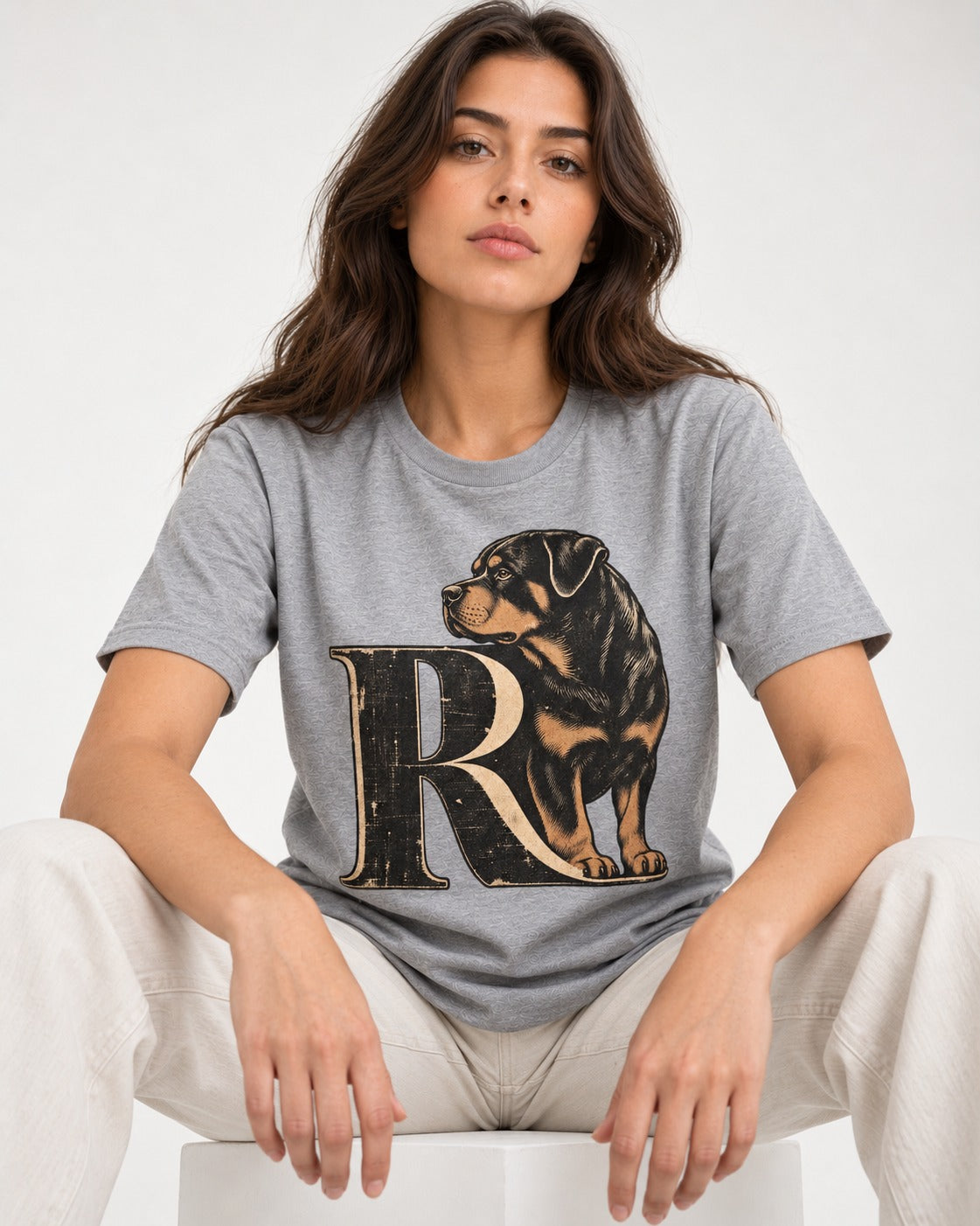 Rottweiler Pride T-Shirt in Sport Grey, worn by a seated model
