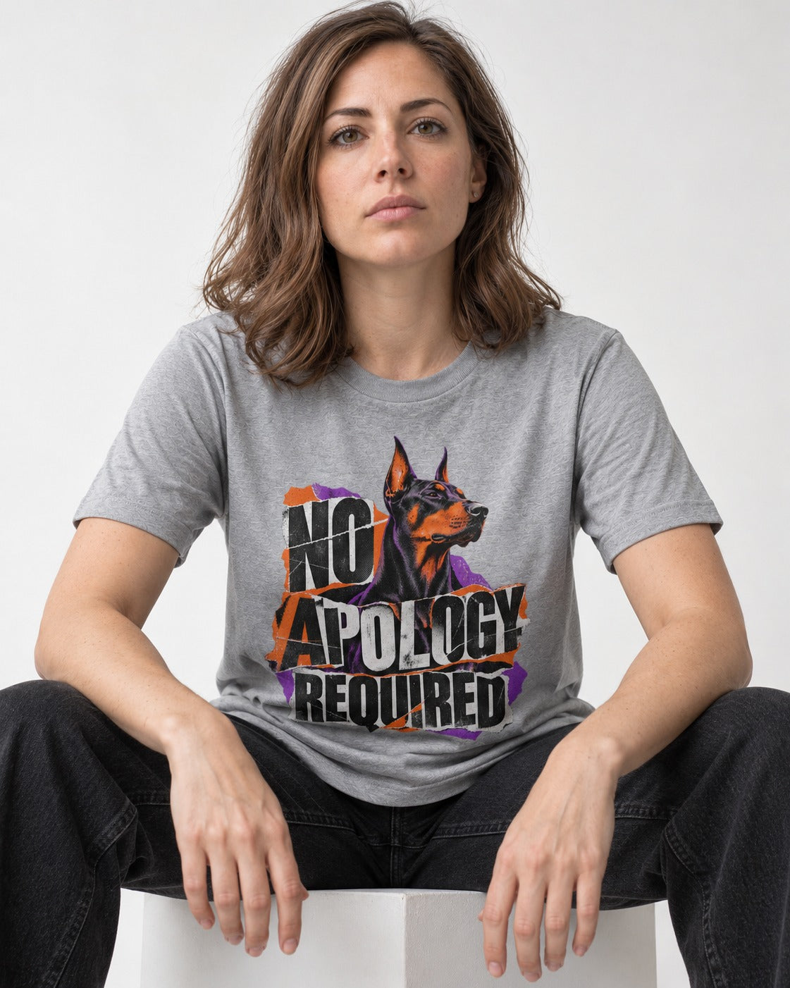 Doberman No Apology Required Torn Paper Graphic T-Shirt in Sport Grey, worn by a seated model
