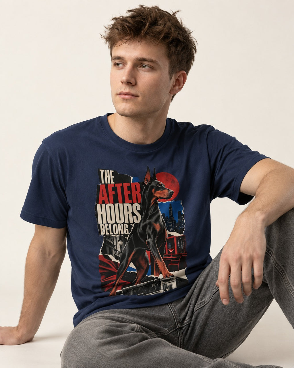 Doberman The After Hours Belong City Collage T-Shirt in Navy, worn by a seated model