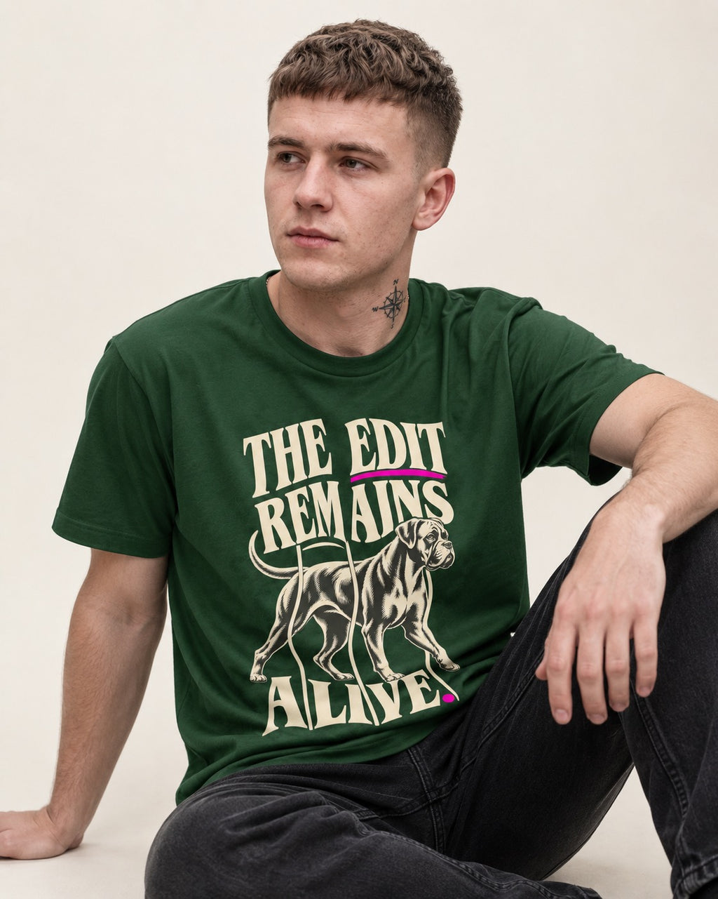The Edit Remains Alive Boxer T-Shirt in Forest Green, worn by a seated model