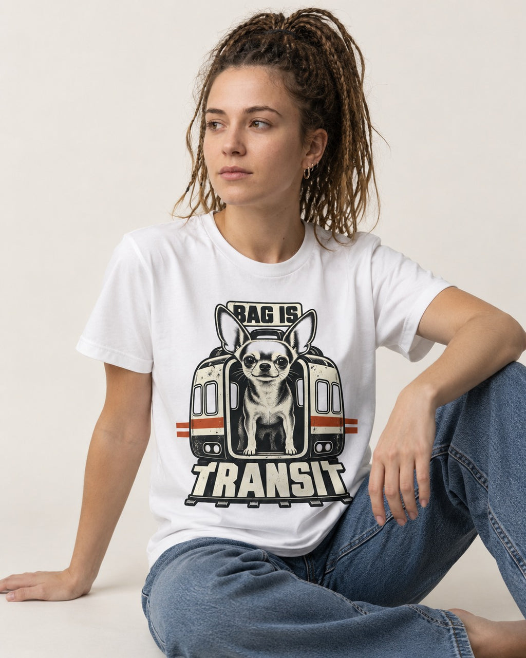 Chihuahua Bag Is Transit Train Front Graphic T-Shirt in White, worn by a seated model