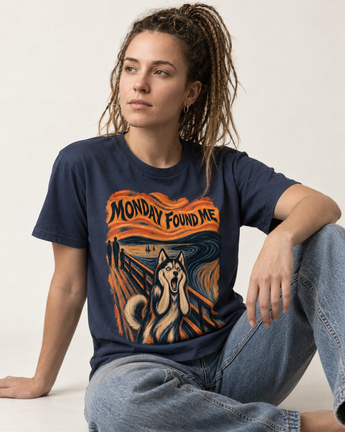 Husky Monday Found Me Scream Parody Graphic T-Shirt in Navy, worn by a seated model
