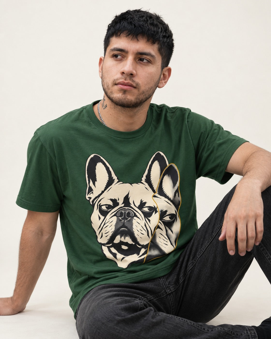 Frenchie Double Crop Side Eye Portrait Graphic T-Shirt in Forest Green, worn by a seated model