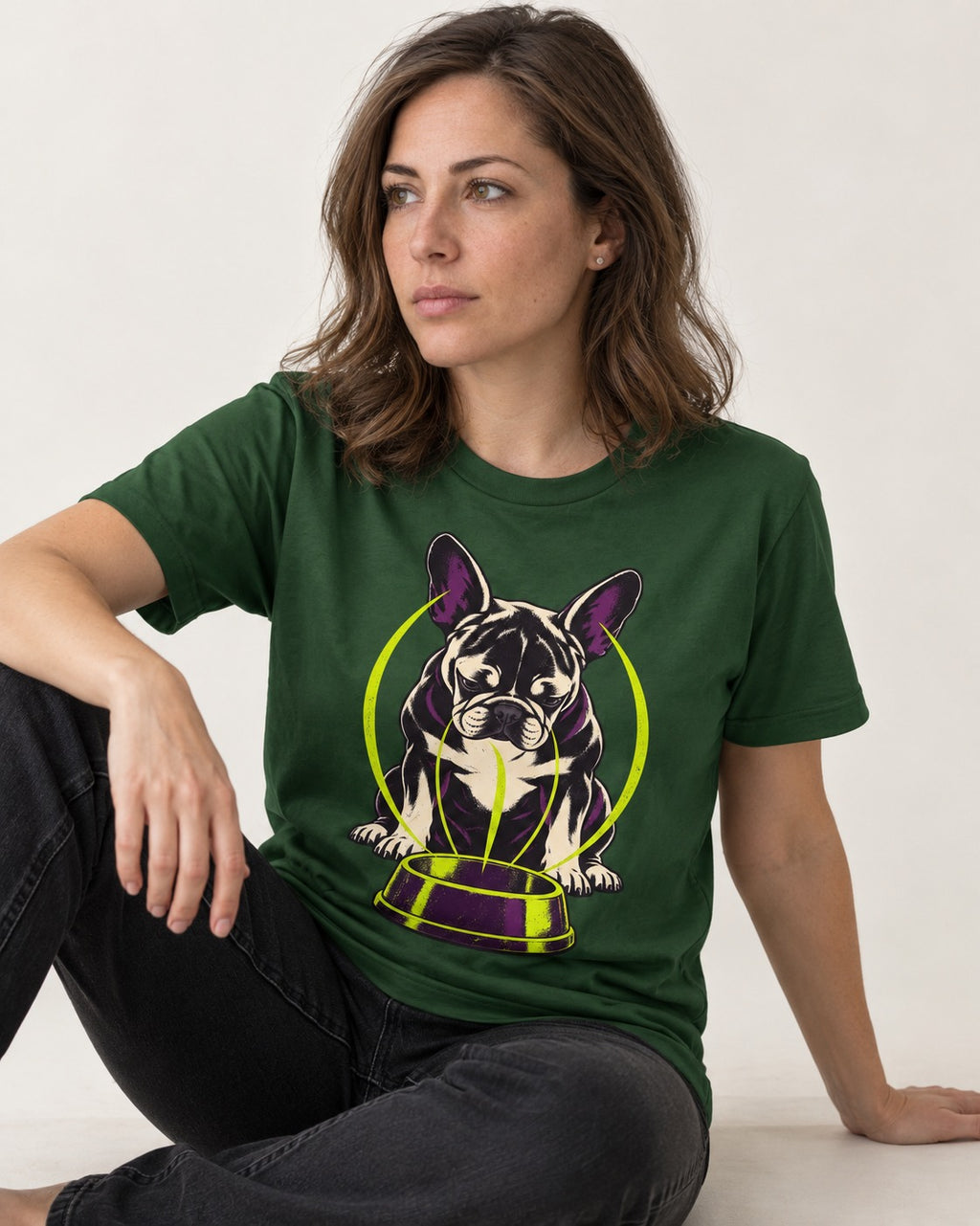 Frenchie Bowl Gravity Graphic T-Shirt in Forest Green, worn by a seated model
