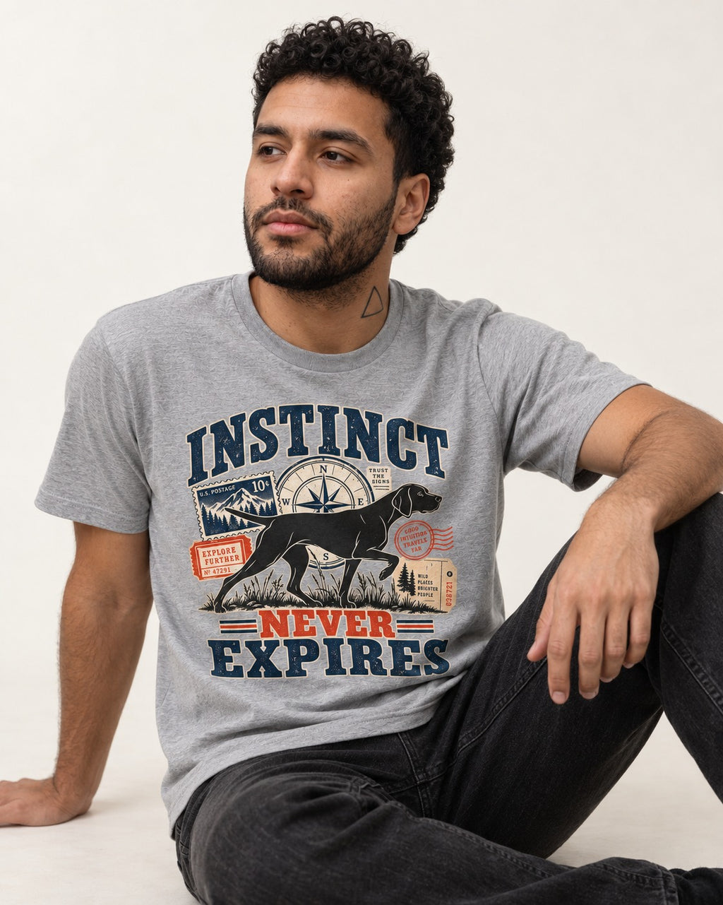 German Shorthaired Pointer Instinct Never Expires T-Shirt in Sport Grey, worn by a seated model
