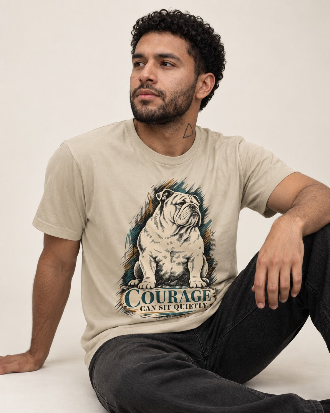 English Bulldog Courage Can Sit Quietly T-Shirt in Sand, worn by a seated model