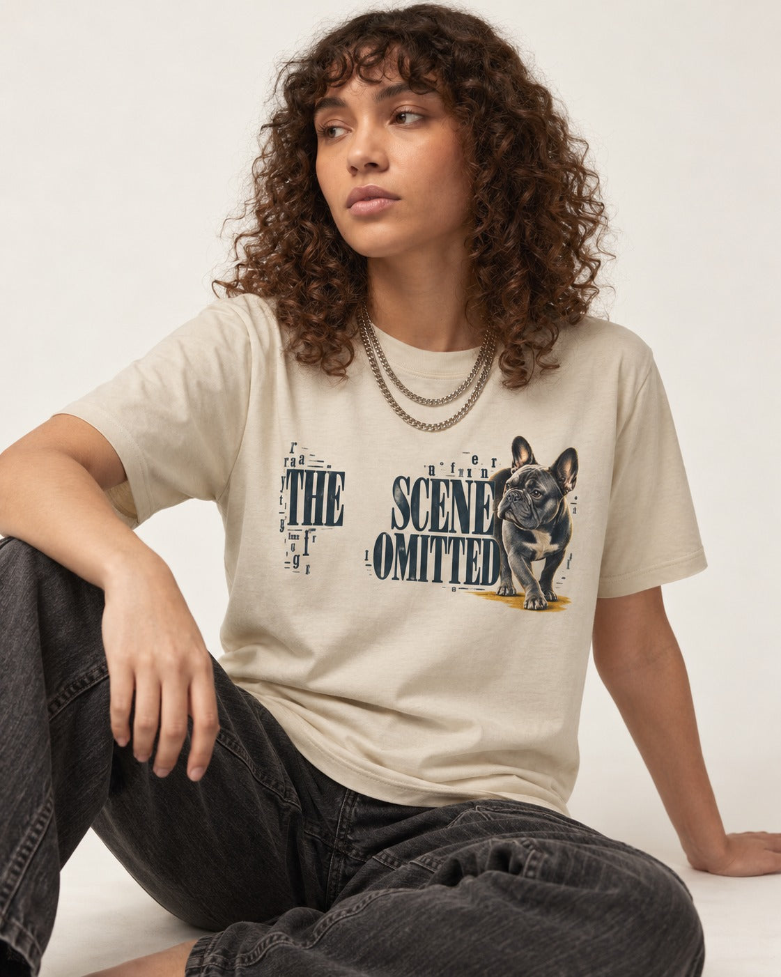 Scene Omitted for Frenchie T-Shirt in Sand, worn by a seated model