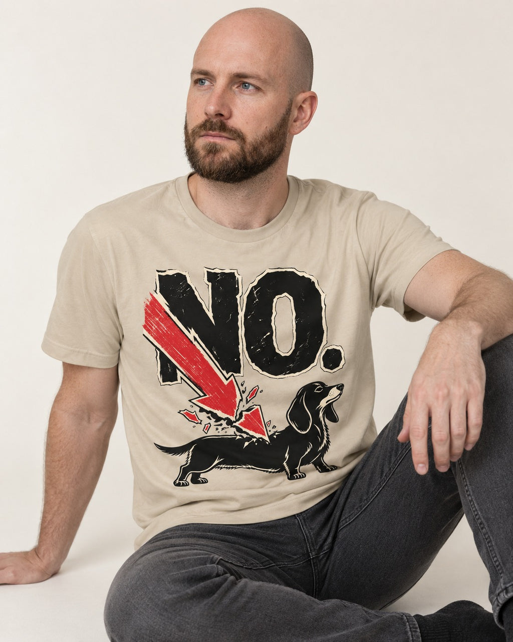 Dachshund Says No T-Shirt in Sand, worn by a seated model