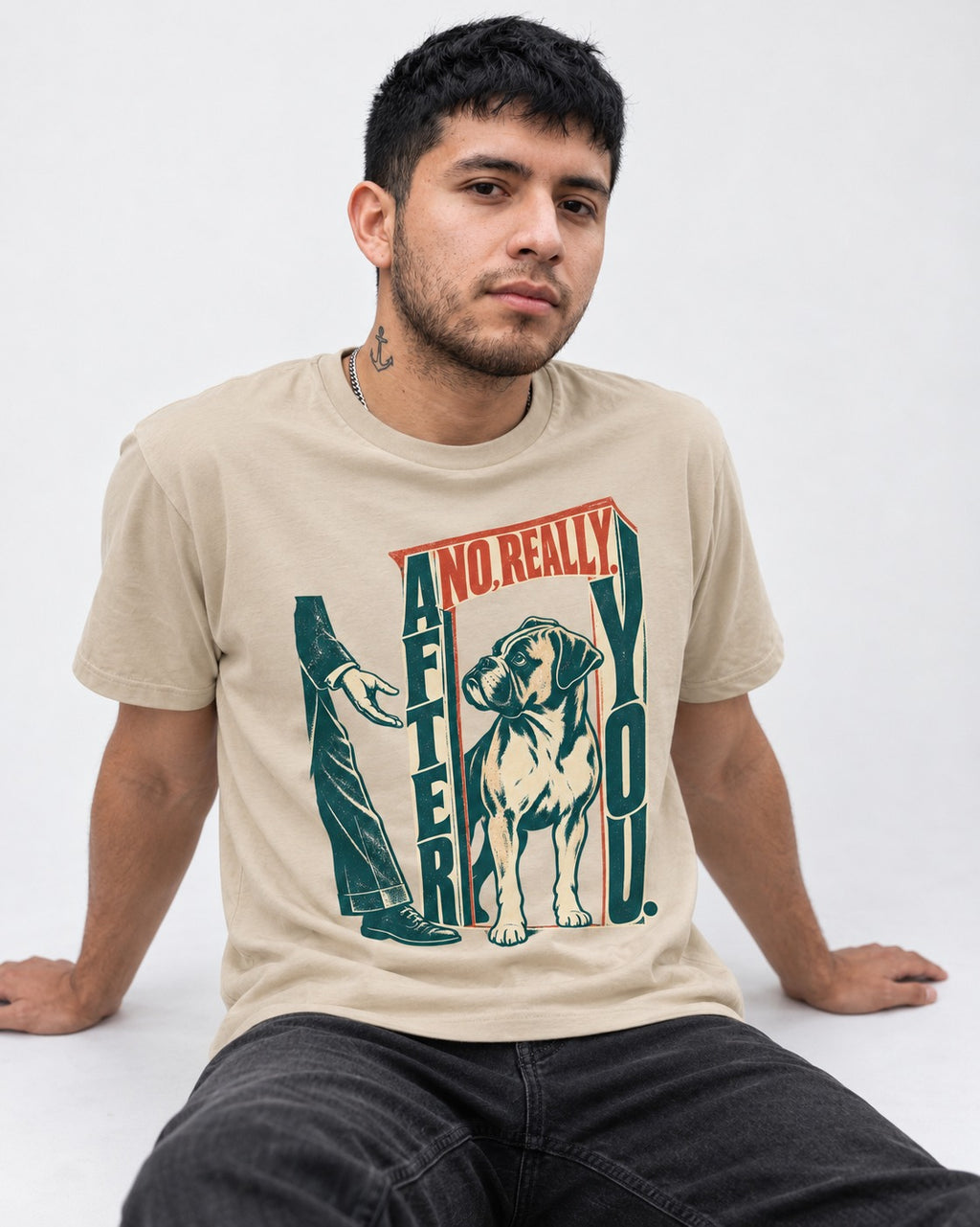 Boxer Says After You T-Shirt in Sand, worn by a seated model