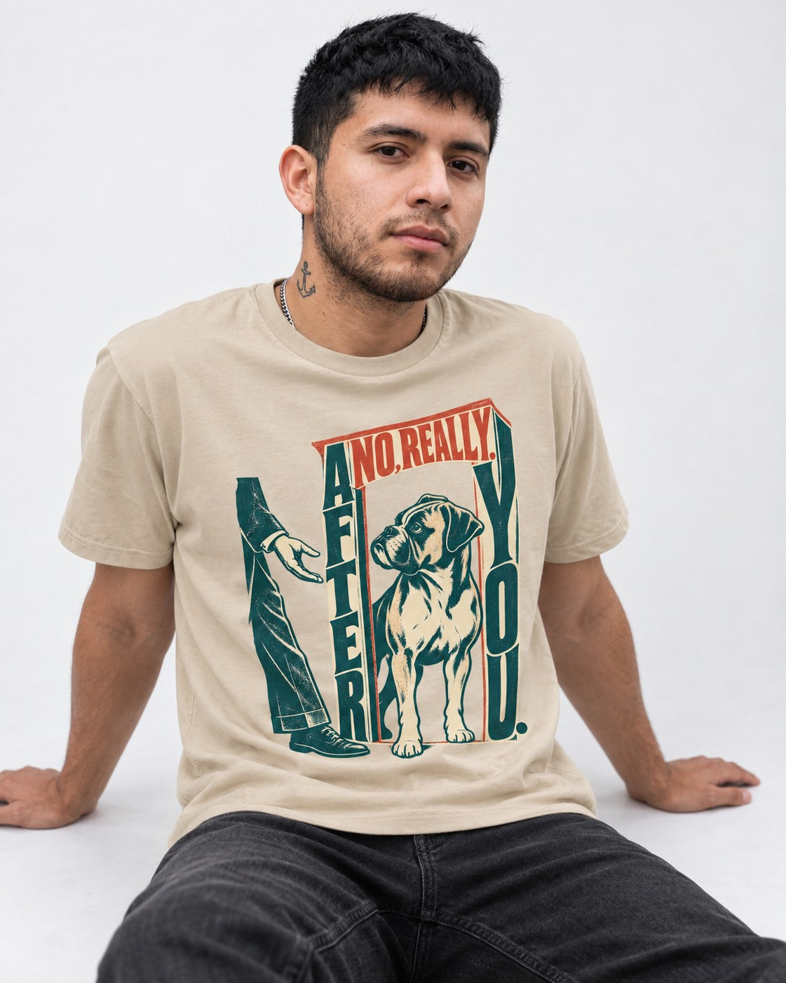 Boxer Says After You T-Shirt in Sand, worn by a seated model