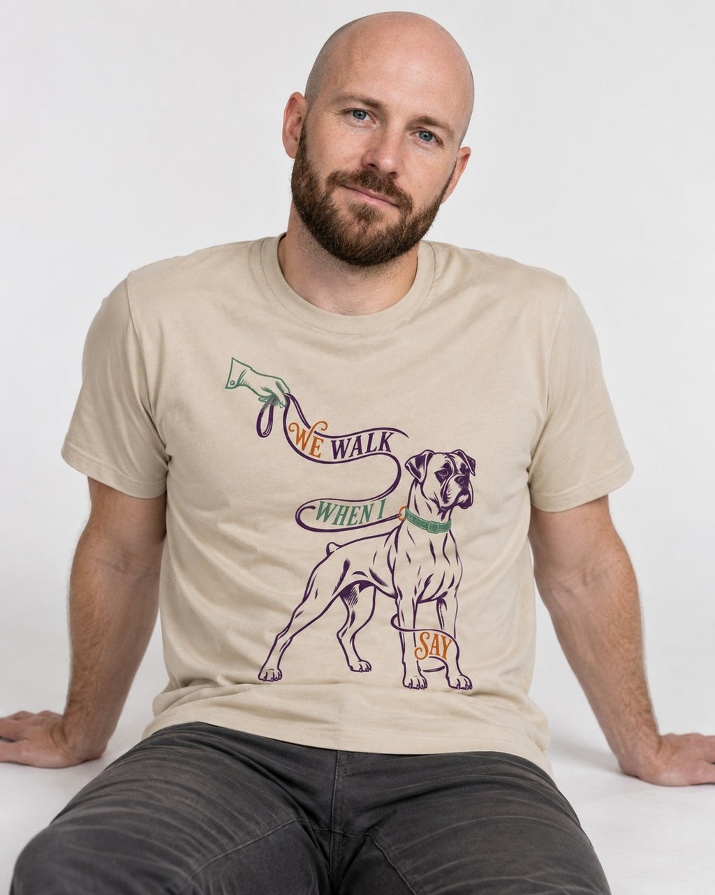 Boxer When I Say T-Shirt in Sand, worn by a seated model