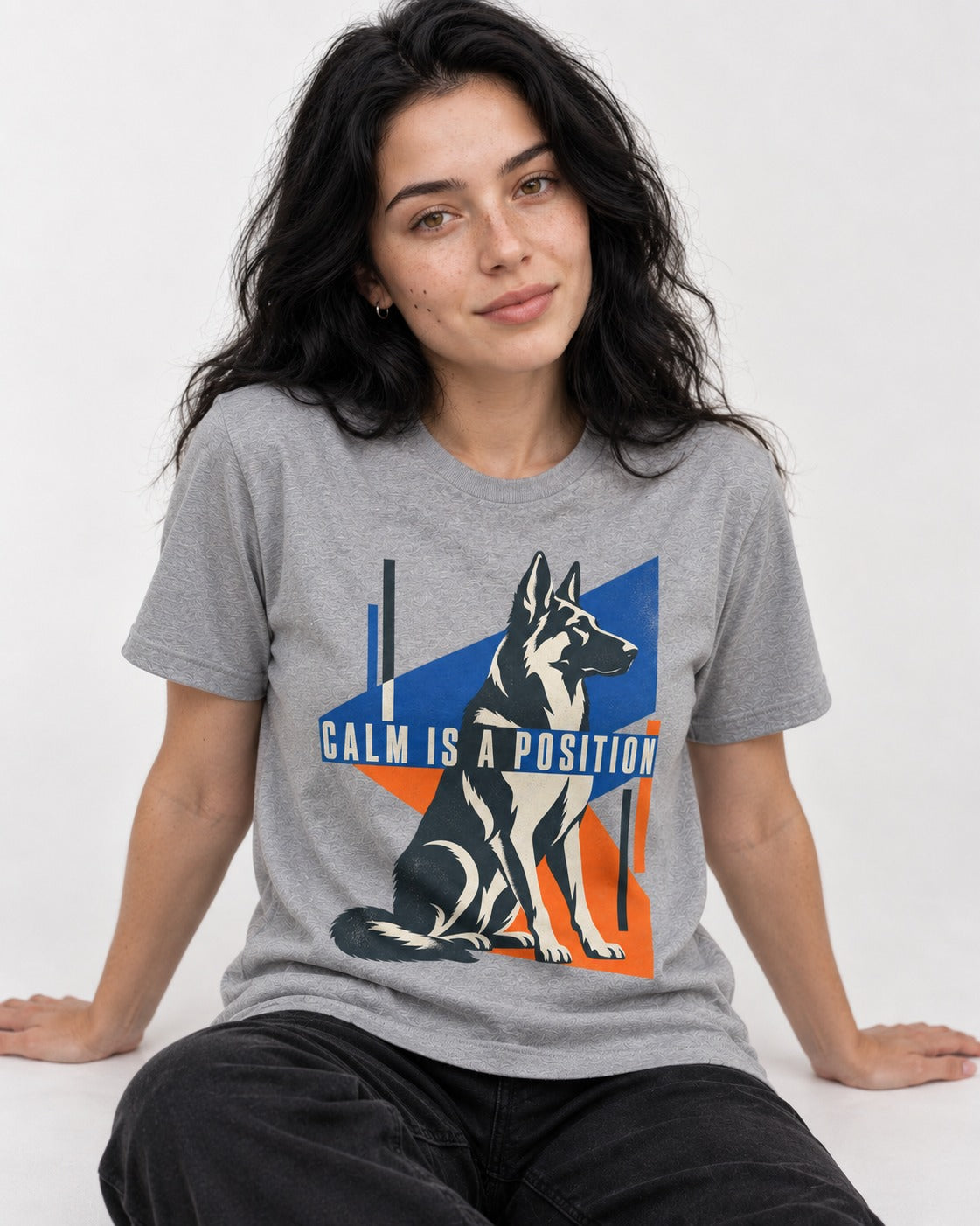 Calm Is A Position Geometric German Shepherd Dog Graphic T-Shirt in Sport Grey, worn by a seated model