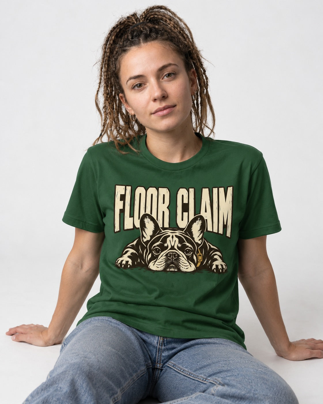 Frenchie Floor Claim Resting Graphic T-Shirt in Forest Green, worn by a seated model