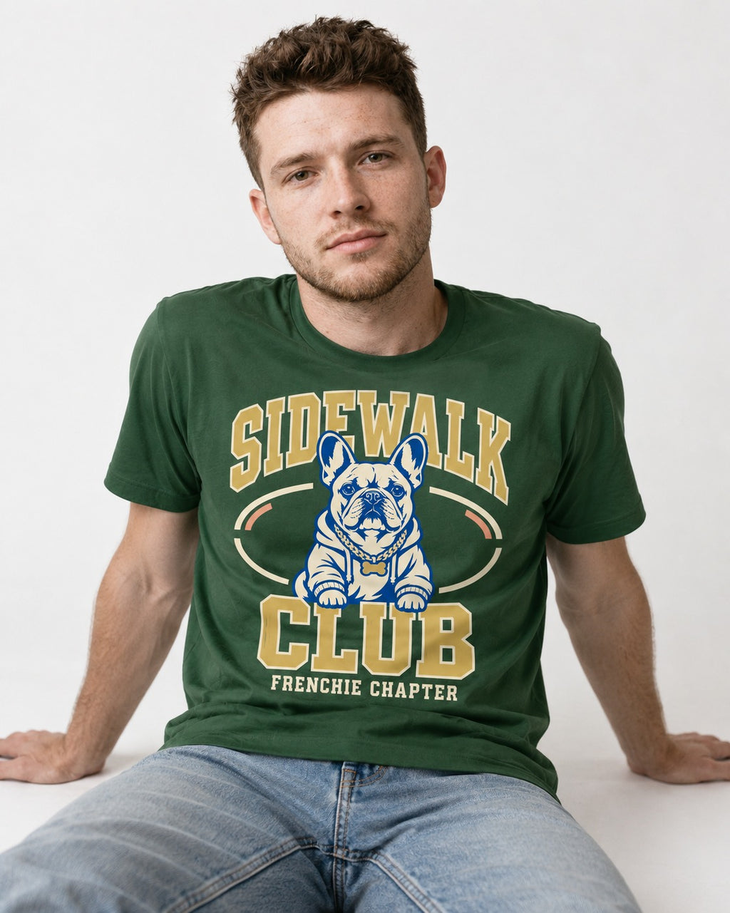 Frenchie Sidewalk Club Chapter Graphic T-Shirt in Forest Green, worn by a seated model