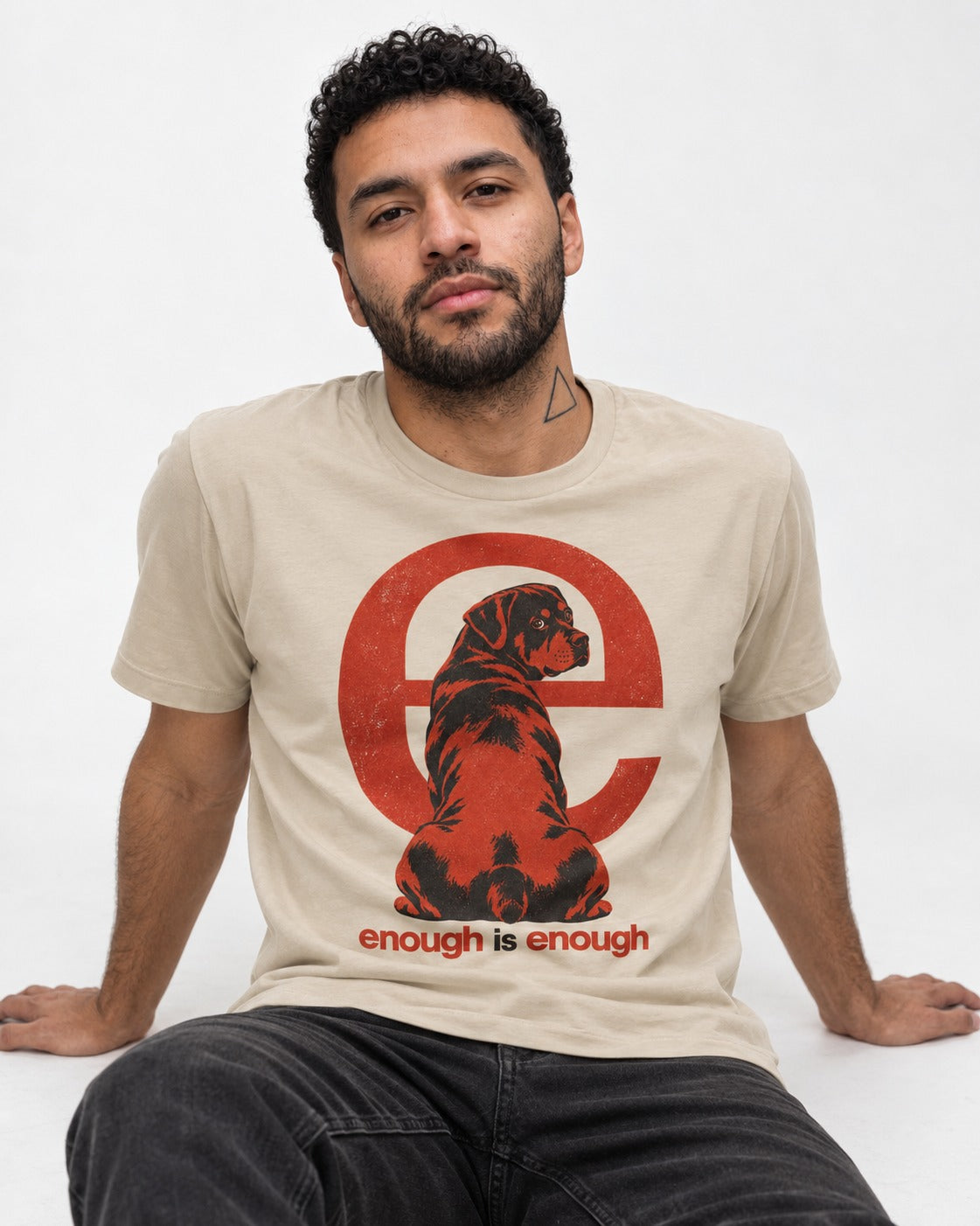 Rottweiler Enough Is Enough T-Shirt in Sand, worn by a seated model