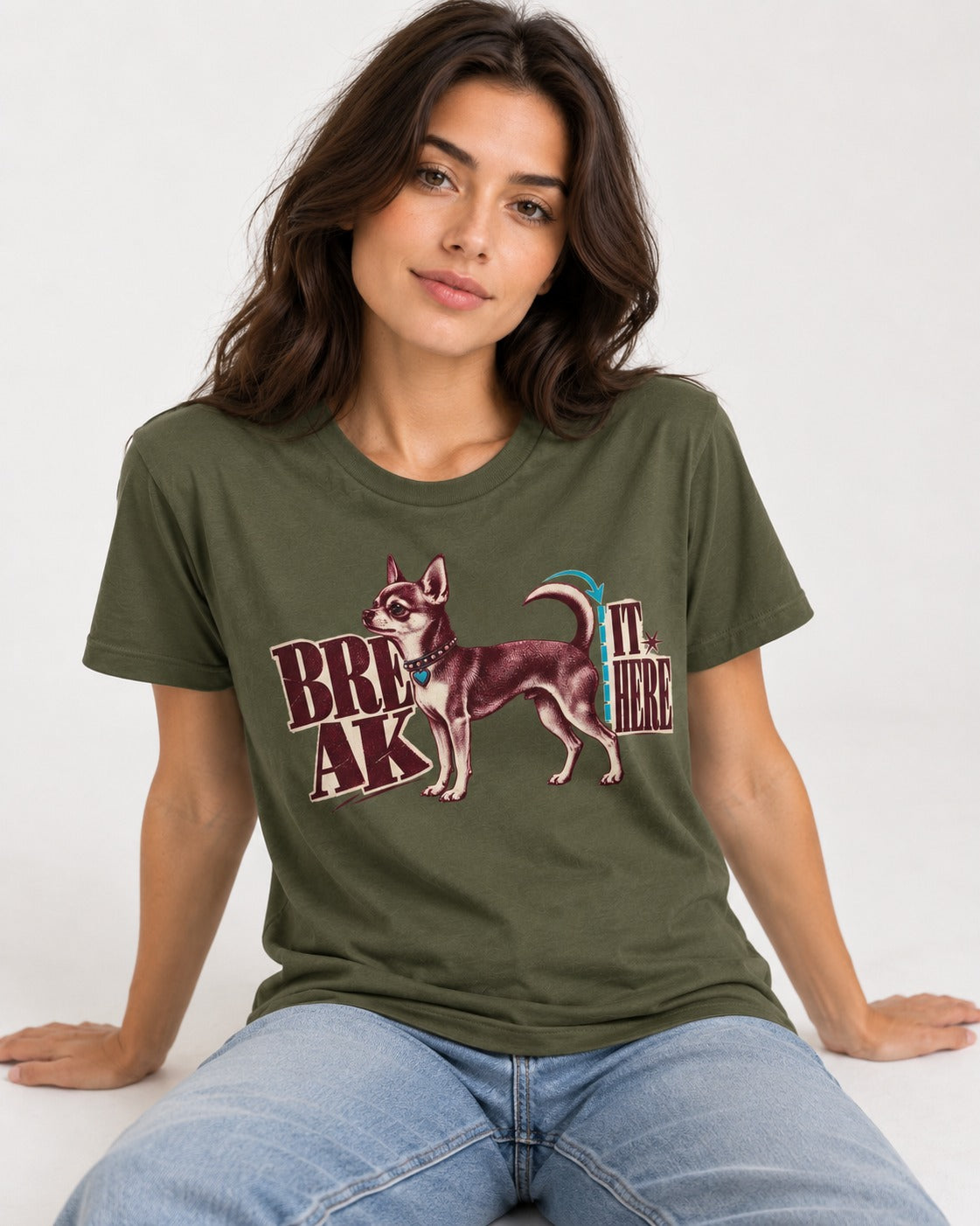 Chihuahua Break It Here Perforation Graphic T-Shirt in Heather Military Green, worn by a seated model