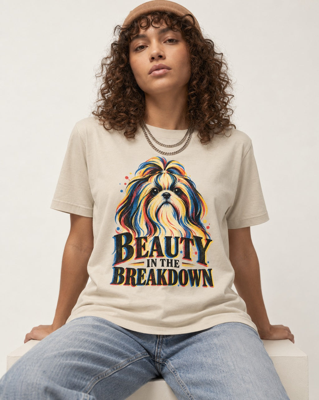 Shih Tzu Beauty in the Breakdown T-Shirt in Sand, worn by a seated model