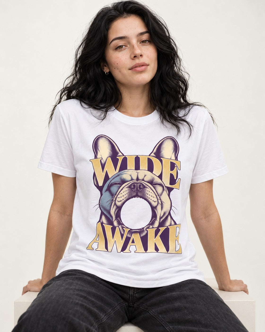 Frenchie Wide Awake Yawn Graphic T-Shirt in White, worn by a seated model