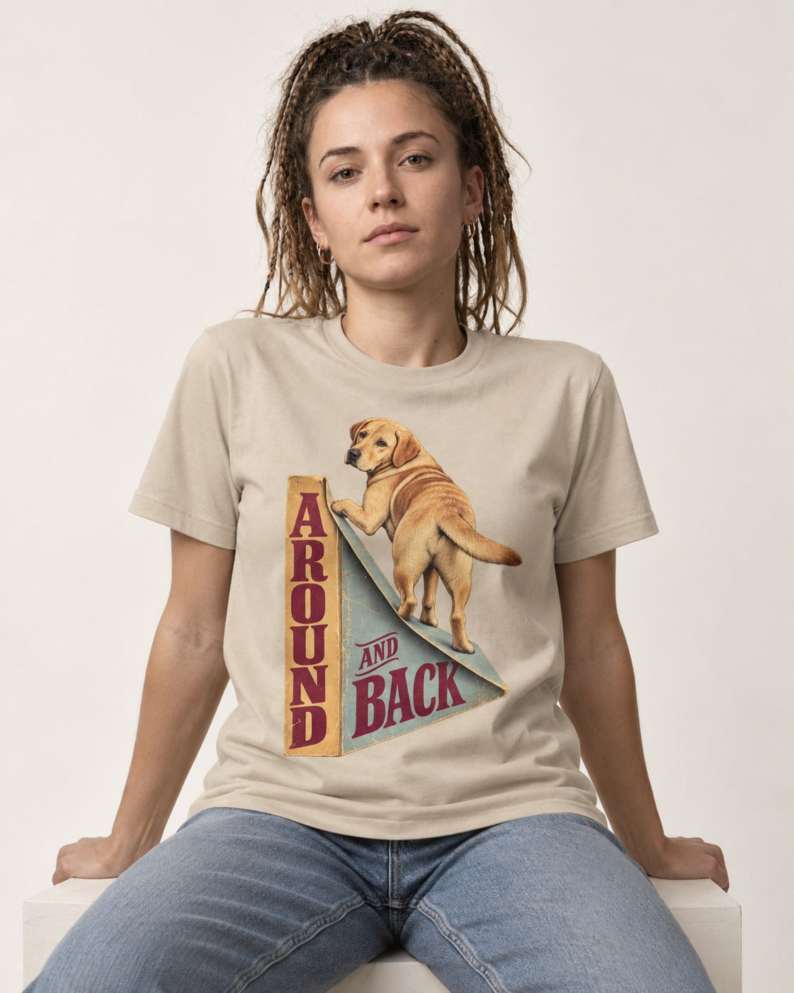 Labrador Retriever Around and Back T-Shirt in Sand, worn by a seated model