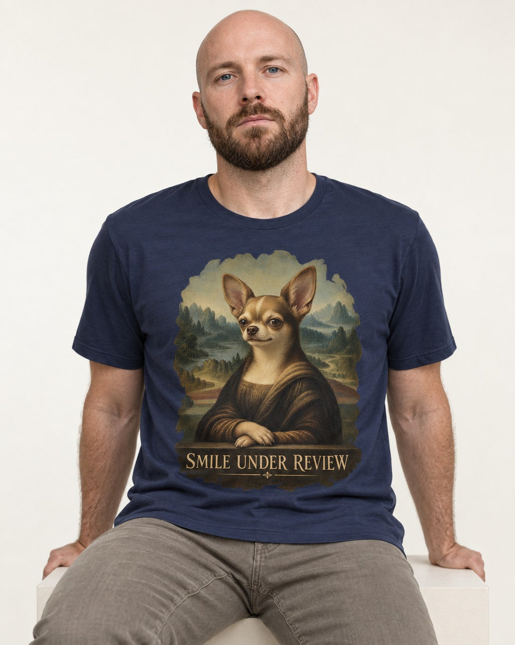 Chihuahua Smile Under Review Mona Lisa Portrait T-Shirt in Navy, worn by a seated model
