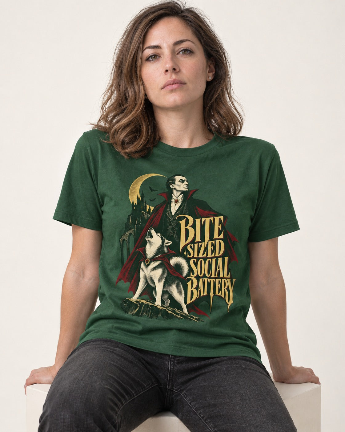 Husky Bite Sized Social Battery Vampire Graphic T-Shirt in Forest Green, worn by a seated model