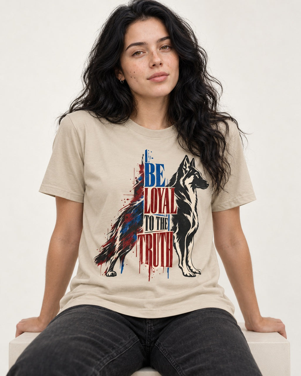 Loyal to the Truth German Shepherd Dog T-Shirt in Sand, worn by a seated model