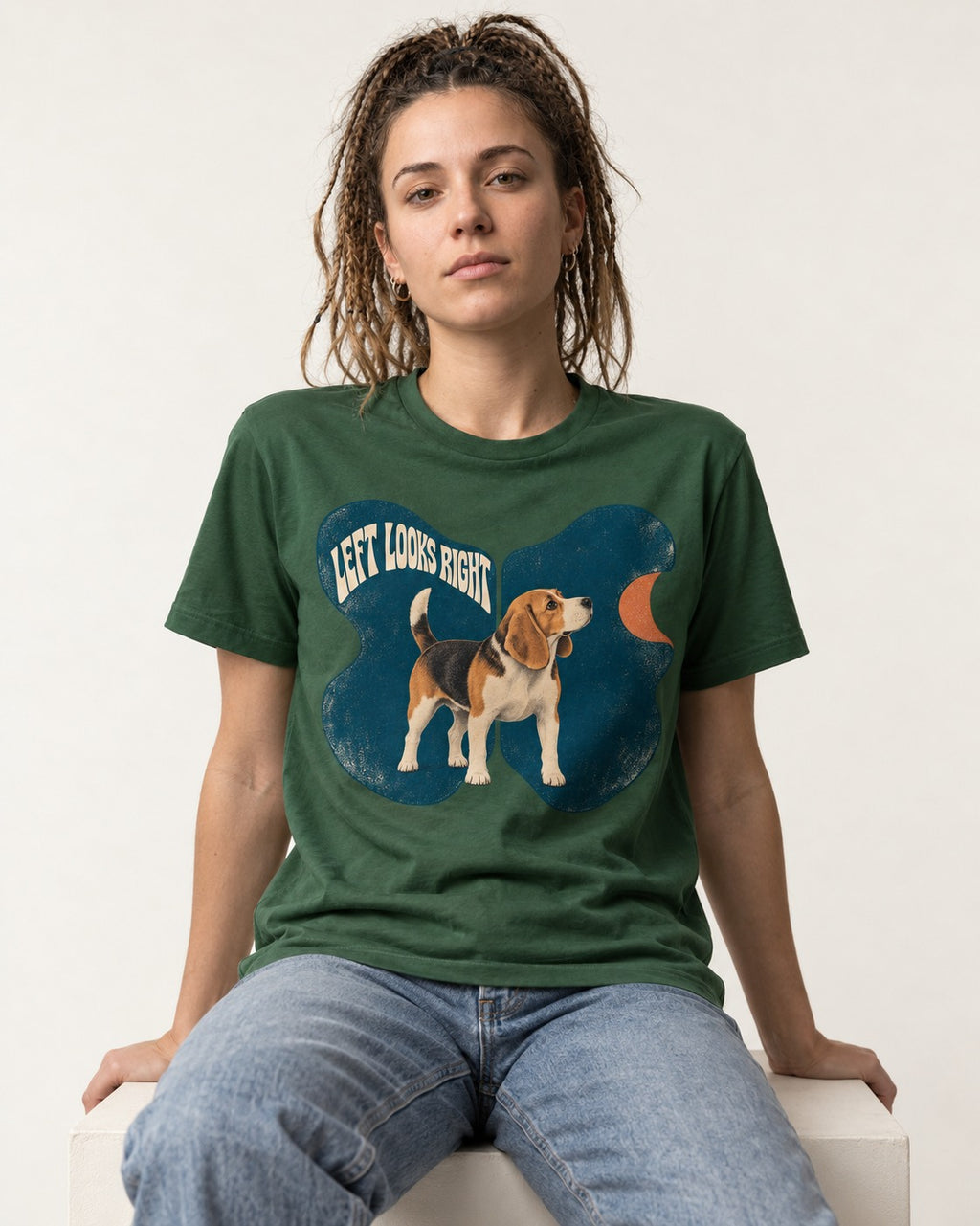 Left Looks Right Beagle Abstract Shapes T-Shirt in Forest Green, worn by a seated model