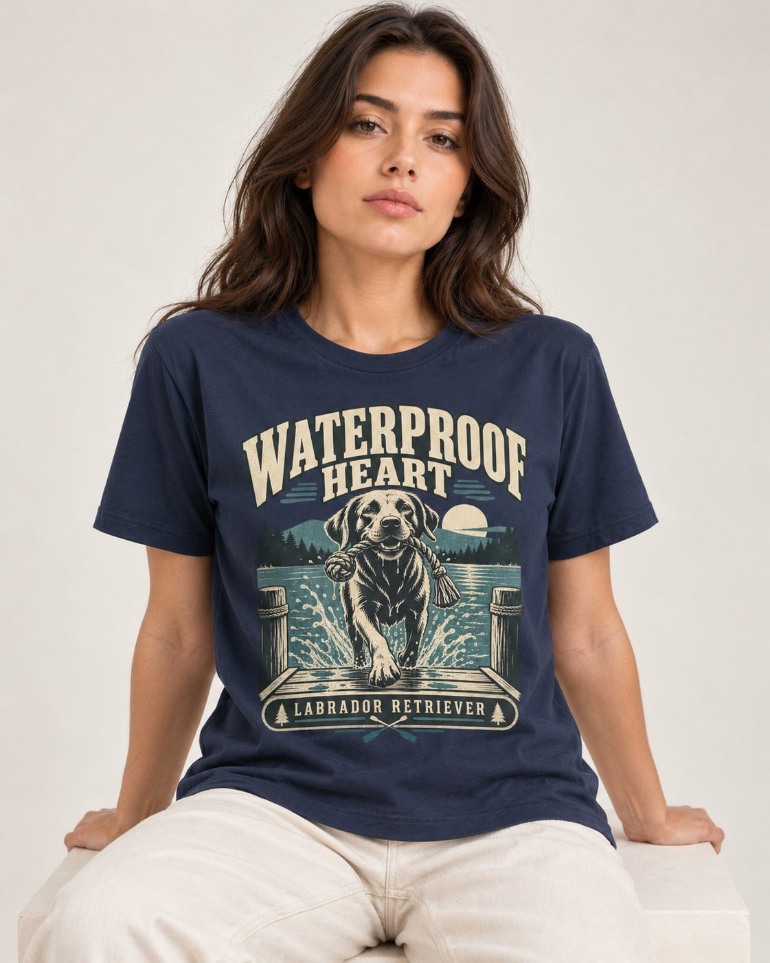 Labrador Retriever Waterproof Heart Lake Adventure Graphic T-Shirt in Navy, worn by a seated model