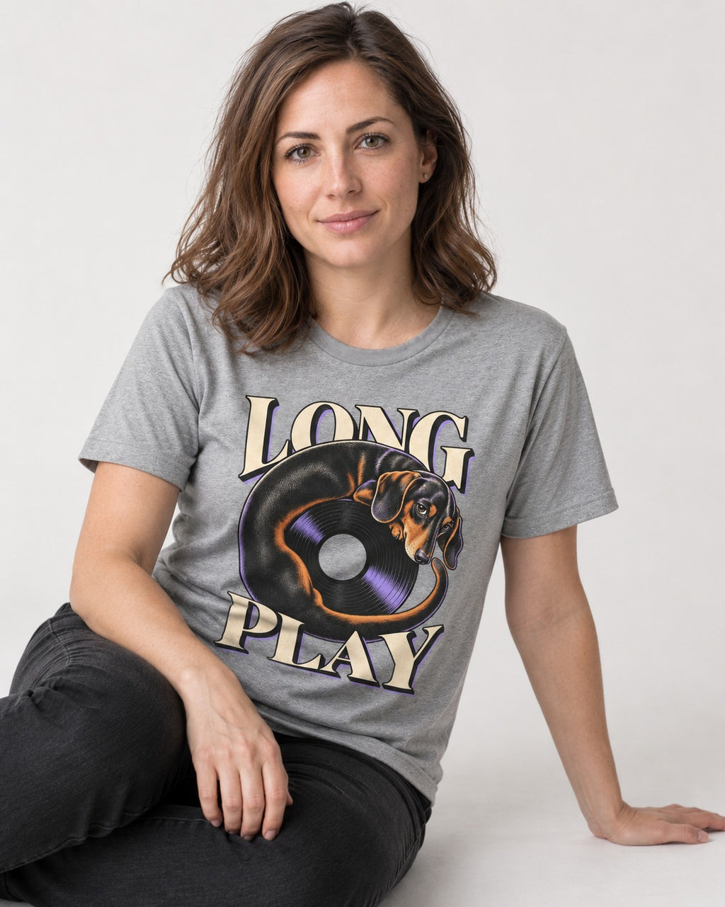 Dachshund Long Play Vinyl Record Graphic T-Shirt in Sport Grey, worn by a seated model
