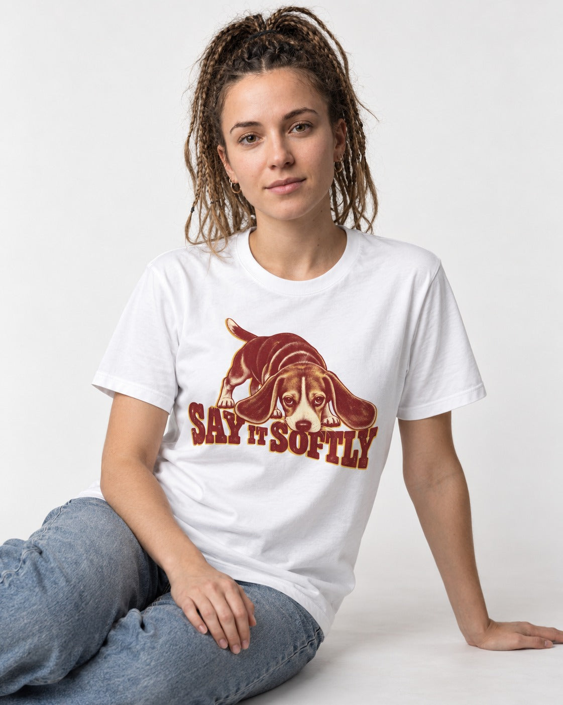 Beagle Say It Softly T-Shirt in White, worn by a seated model