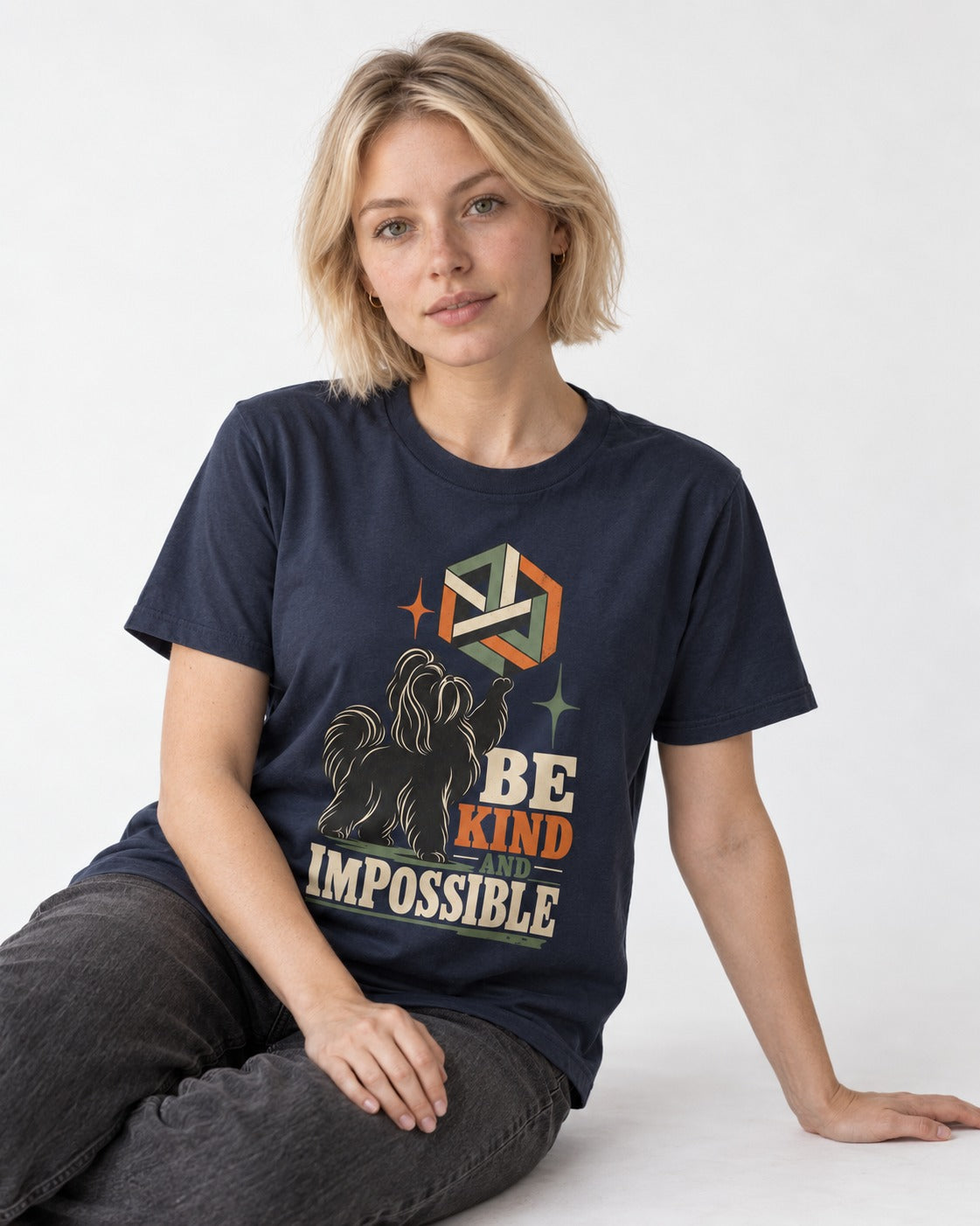 Shih Tzu Be Kind and Impossible Geometric Cube Graphic T-Shirt in Navy, worn by a seated model