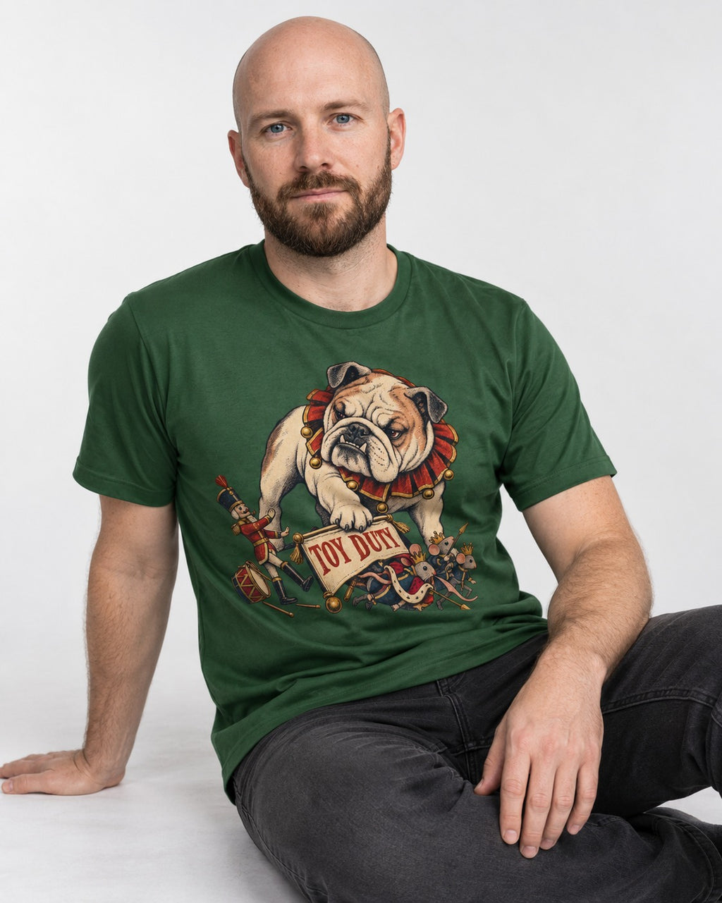 English Bulldog Toy Duty Nutcracker Mice T-Shirt in Forest Green, worn by a seated model