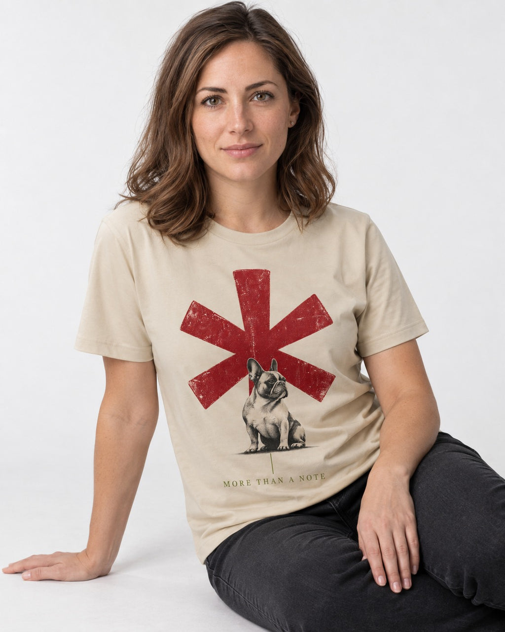 Frenchie More Than a Note T-Shirt in Sand, worn by a seated model