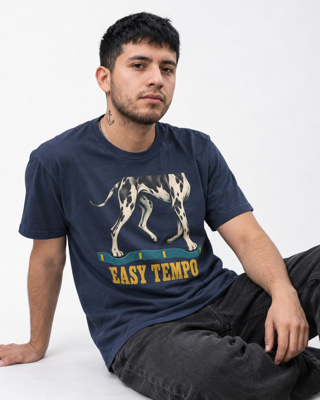 Great Dane Easy Tempo Elastic Band Legs Graphic T-Shirt in Navy, worn by a seated model