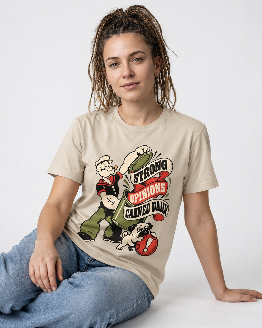 Pug Strong Opinions T-Shirt in Sand, worn by a seated model