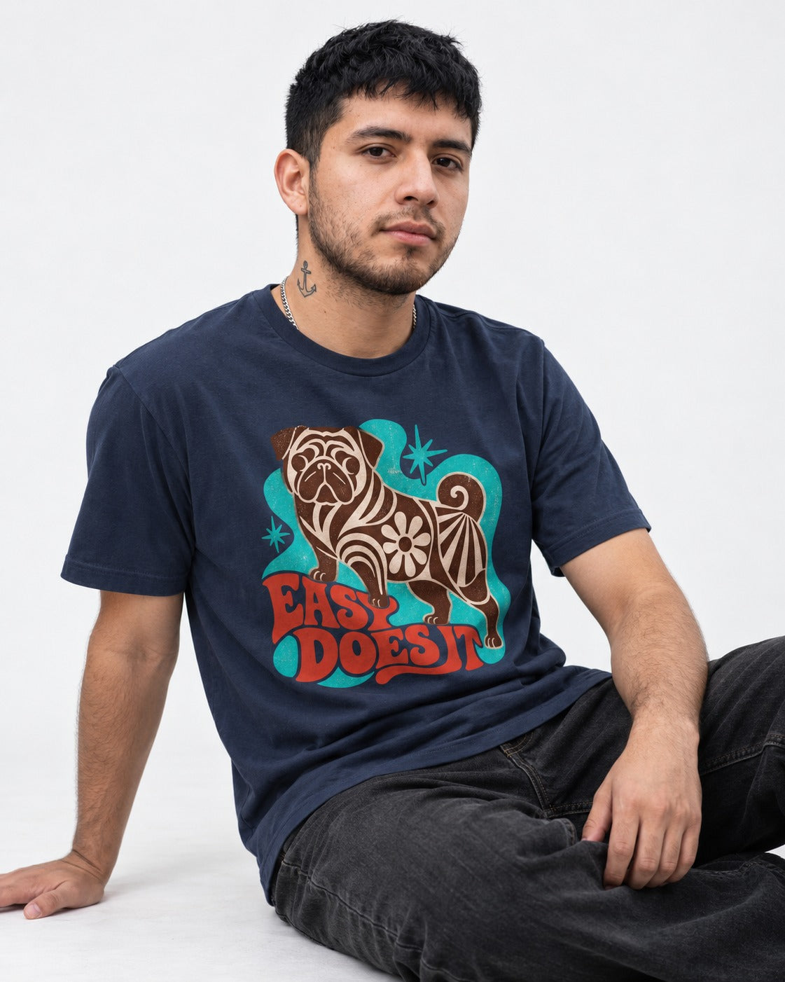 Pug Easy Does It Retro Floral Graphic T-Shirt in Navy, worn by a seated model