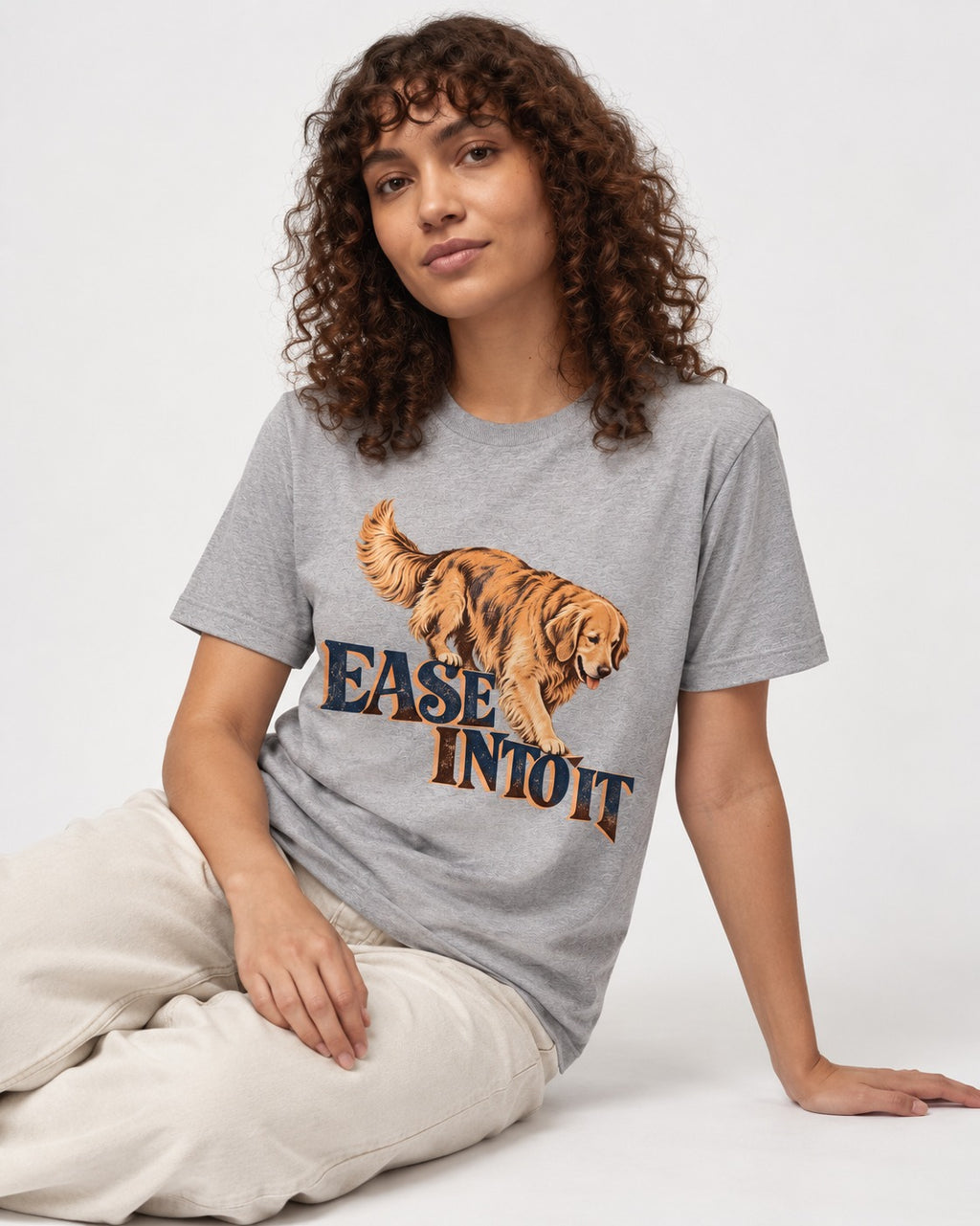 Golden Retriever Ease Into It T-Shirt in Sport Grey, worn by a seated model