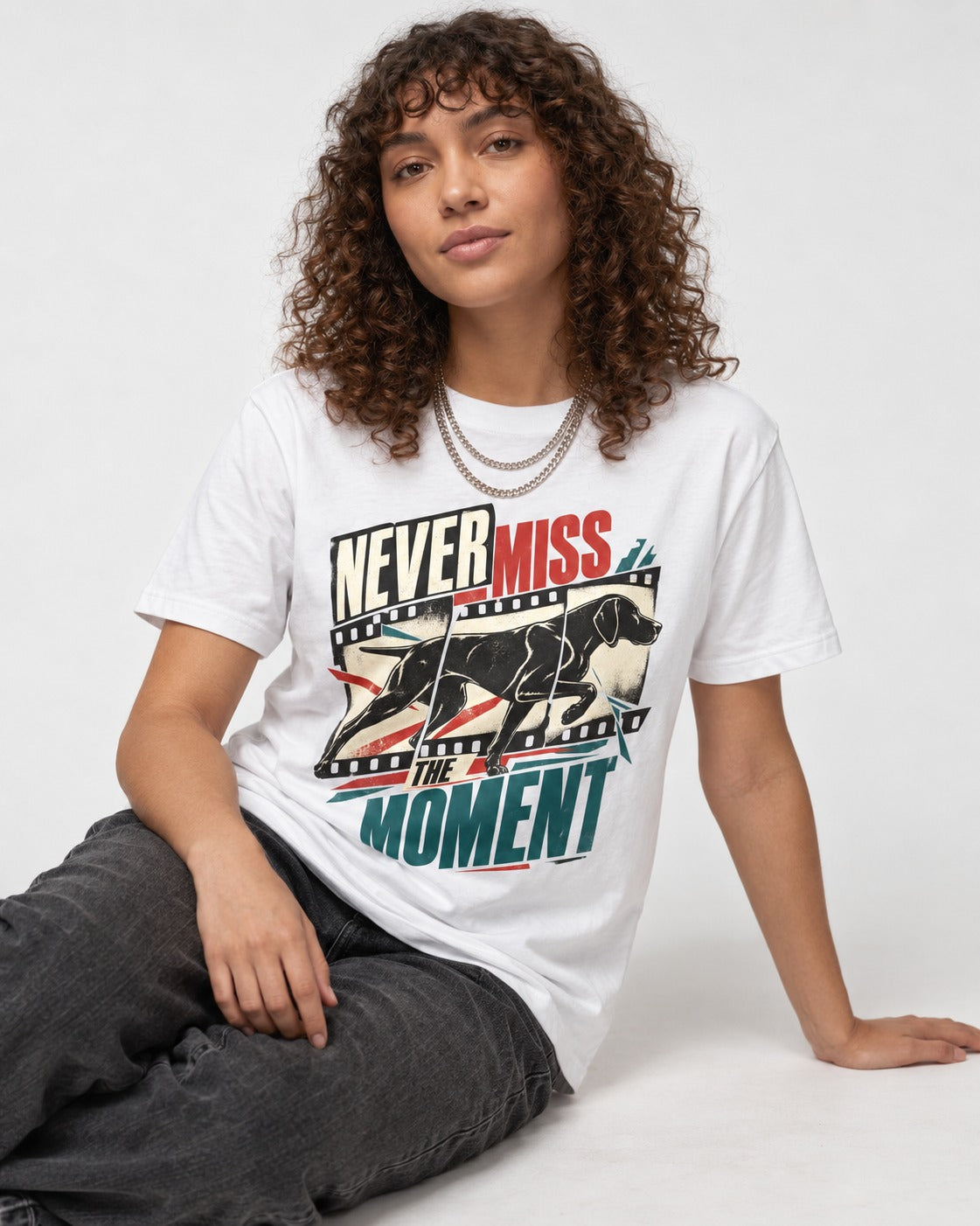 German Shorthaired Pointer Never Miss the Moment Filmstrip Graphic T-Shirt in White, worn by a seated model