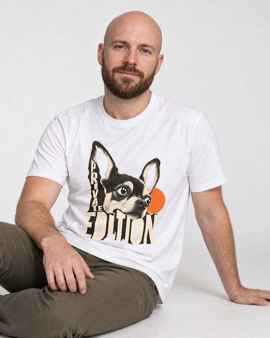 Chihuahua Private Edition Cut-Paper Portrait T-Shirt in White, worn by a seated model