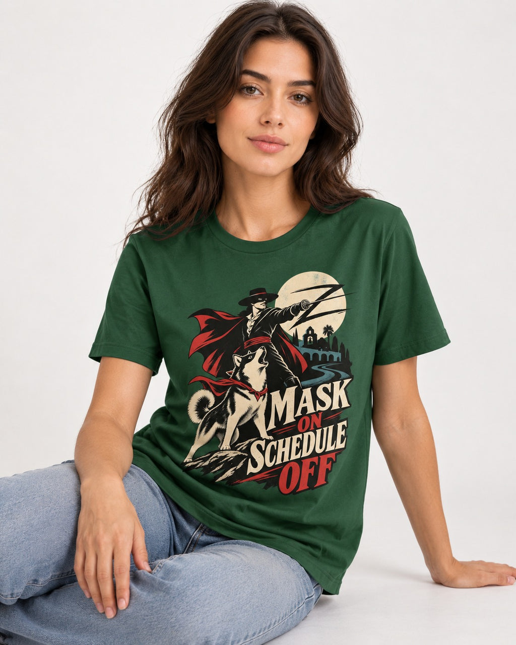 Husky Mask On Schedule Off Masked Swordsman Graphic T-Shirt in Forest Green, worn by a seated model