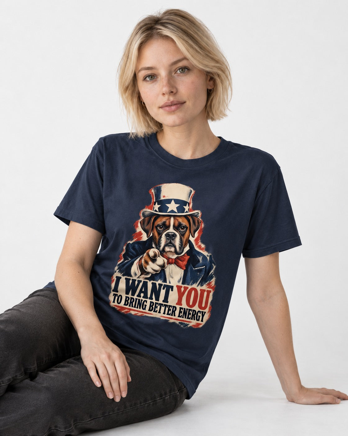I Want You to Bring Better Energy Boxer Recruitment Poster Graphic T-Shirt in Navy, worn by a seated model